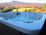 Hot tub by campfire and mountain views